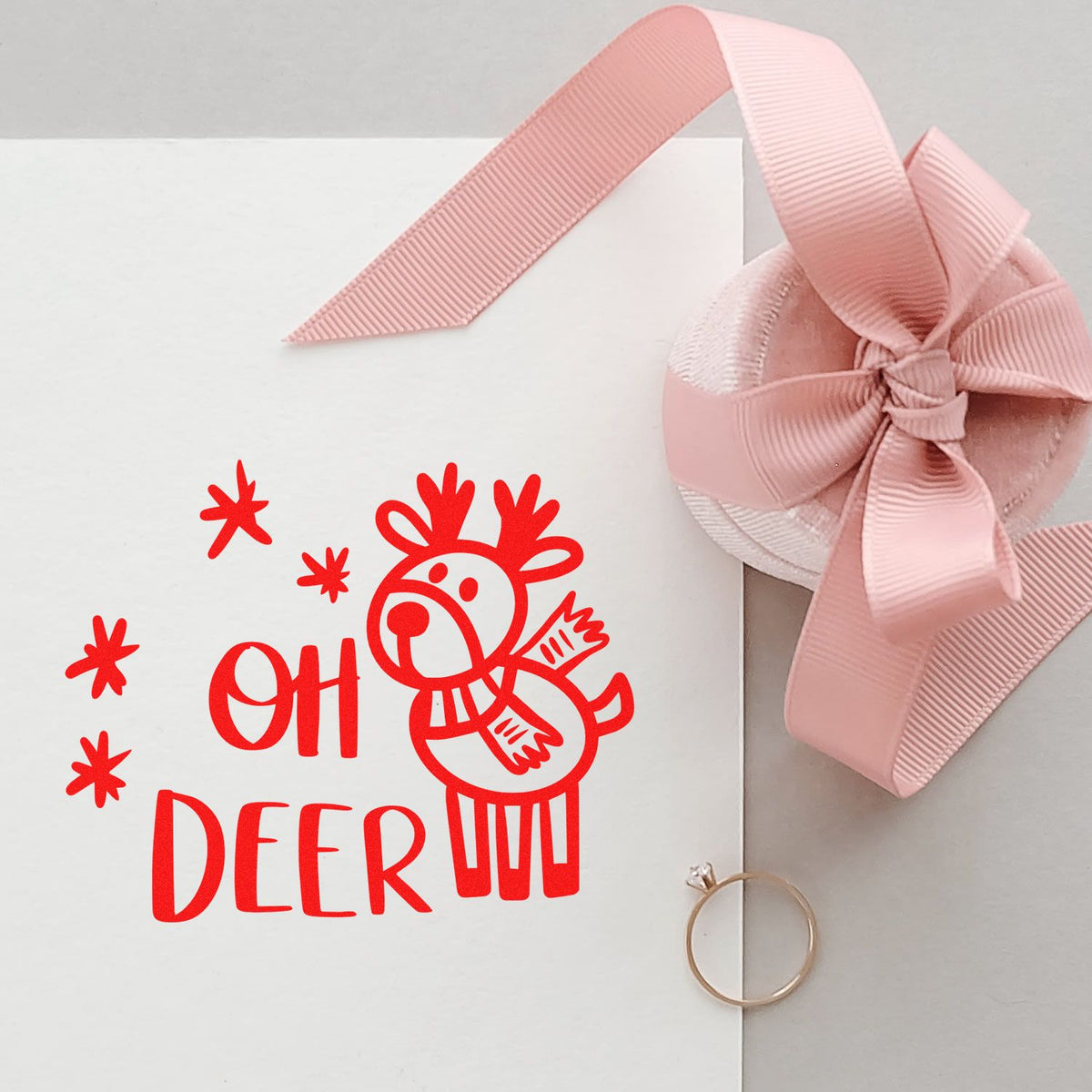 Reindeer rubber stamp with Oh Deer holiday pun for Christmas gift tags and festive packaging.