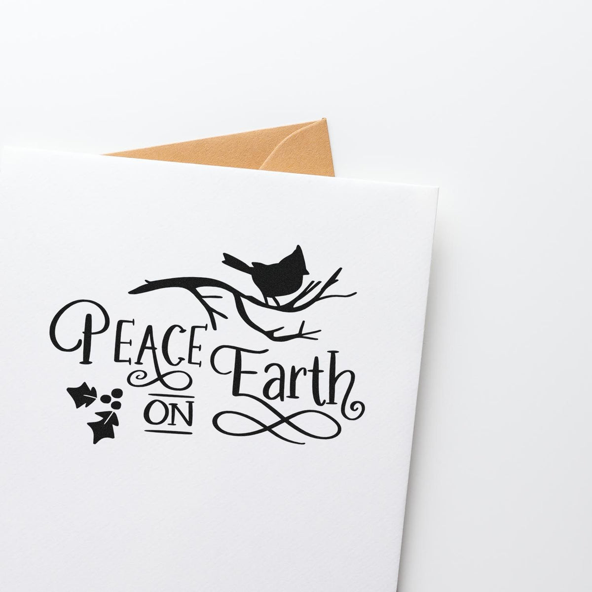 Peace on Earth rubber stamp design with bird on branch, ideal for holiday greeting cards and handmade card making.
