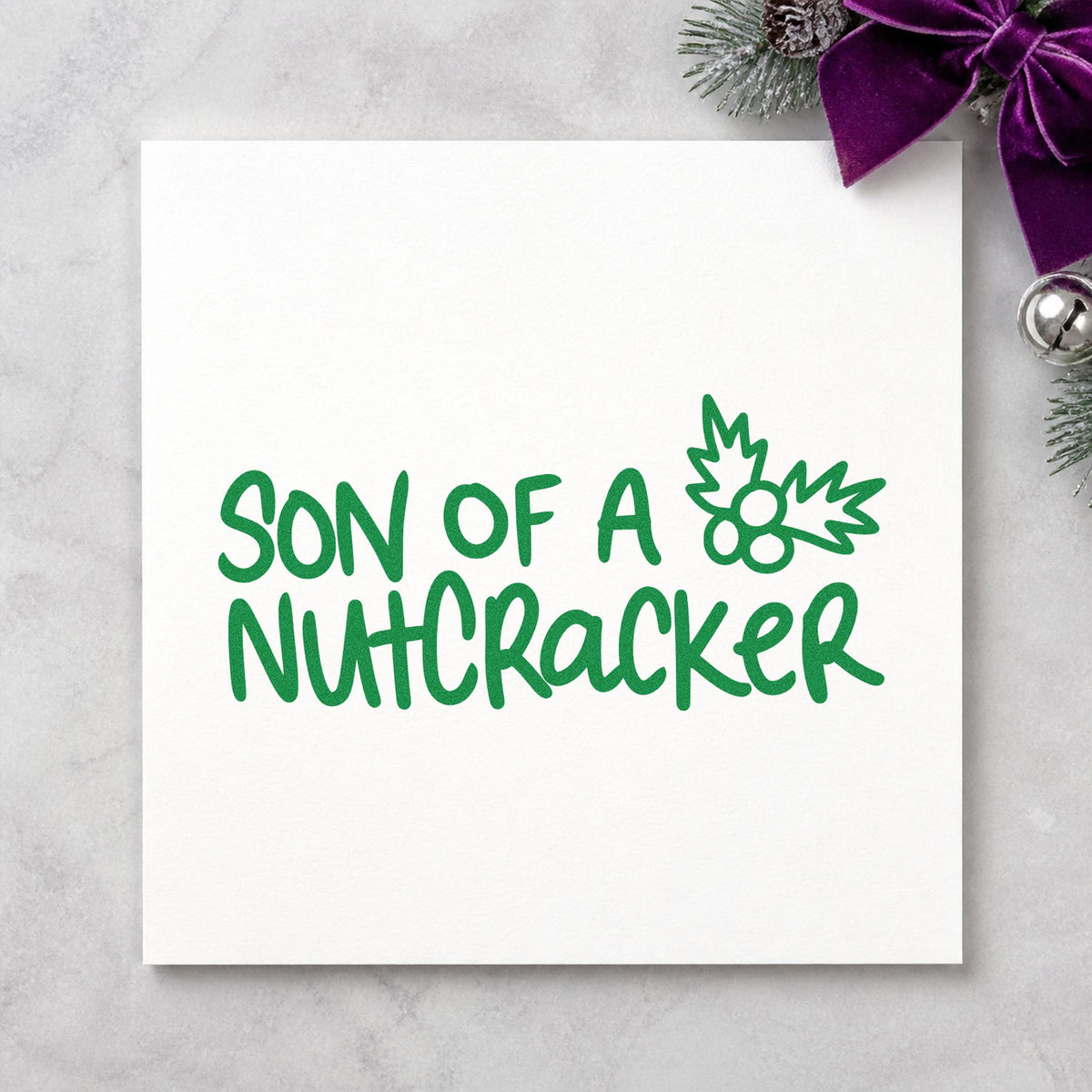 Son Of A Nutcracker craft stamp imprinted in green ink on paper, a design suited to framed media nook.