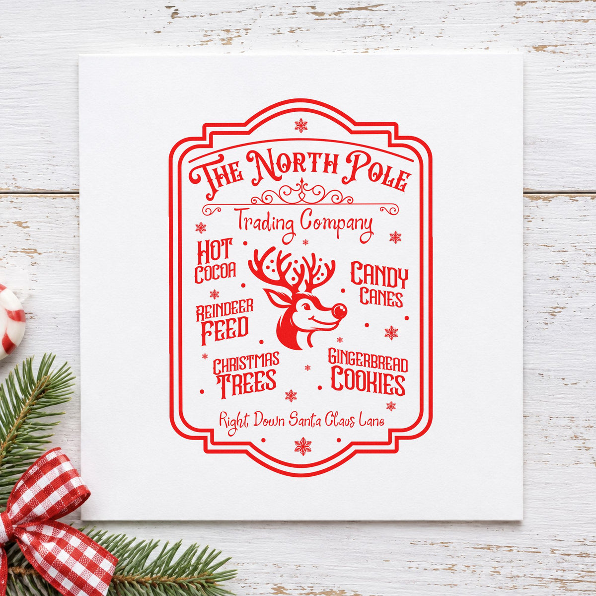 North Pole Trading Company Sign craft stamp in red ink on cardstock, an easy option for shop apron printing.
