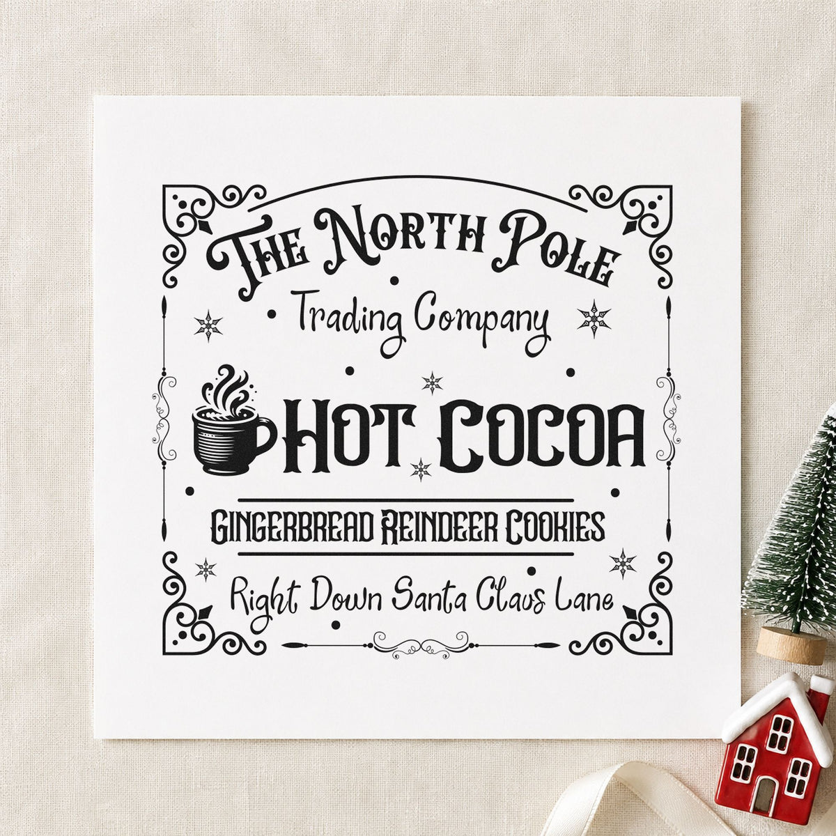 North Pole Trading Hot Cocoa craft stamp imprint in black ink on a handmade project, one idea being sleeve order tags.