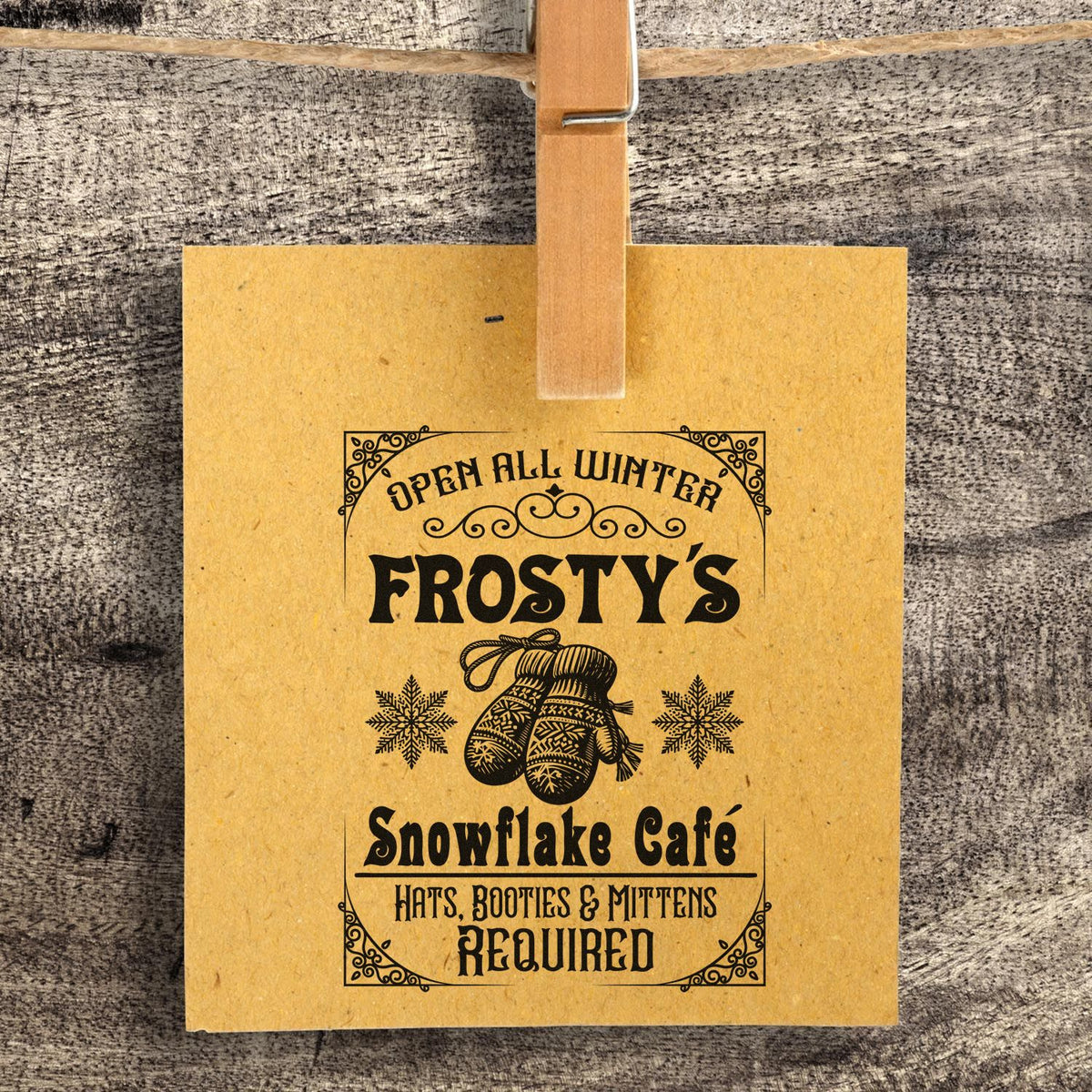 Winter cafe rubber stamp design for Frosty's Snowflake Cafe with mittens, snowflakes, and Hats, Booties & Mittens Required text.