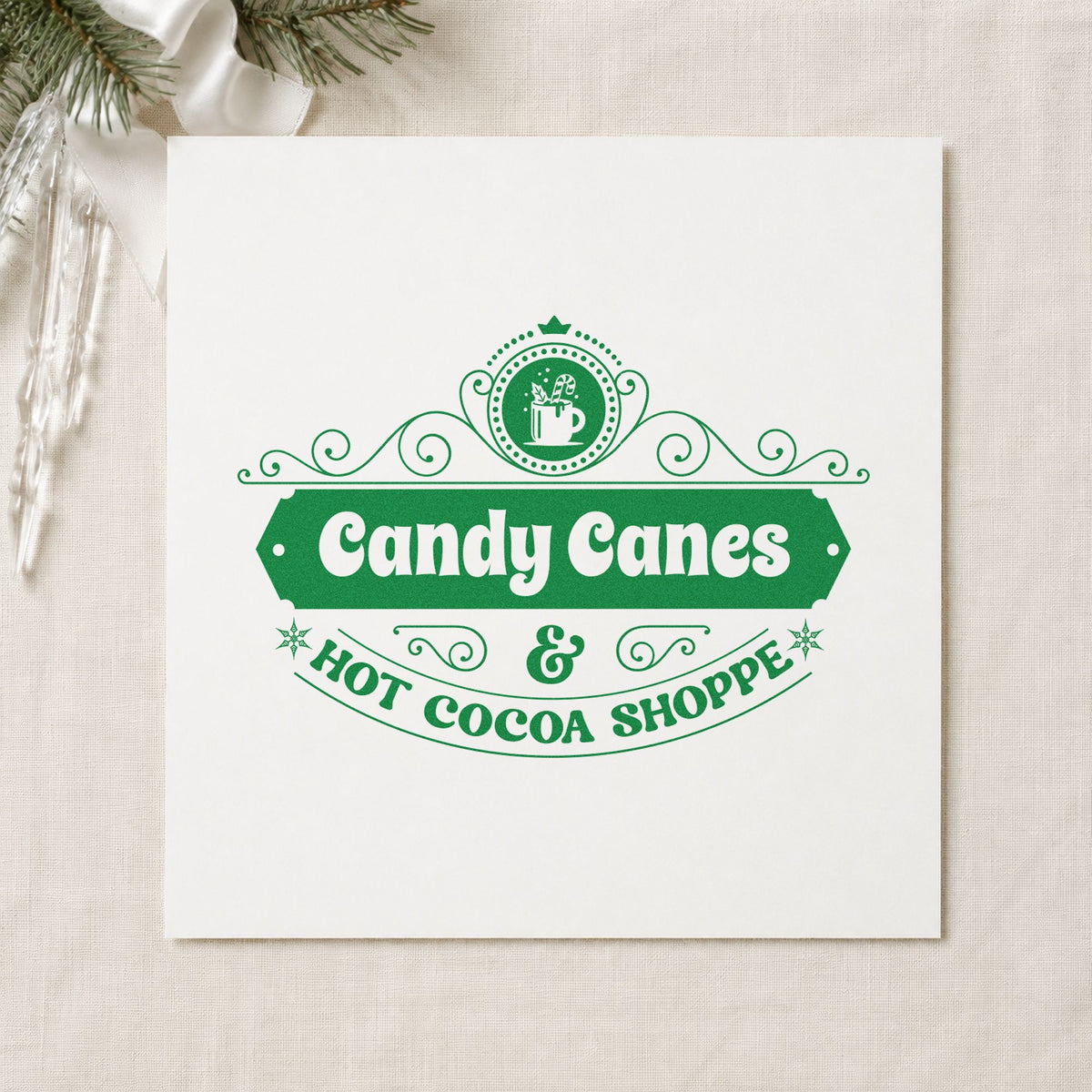 Candy Canes Hot Cocoa Shoppe craft stamp imprinted in green ink on paper, a design suited to framed shop door.