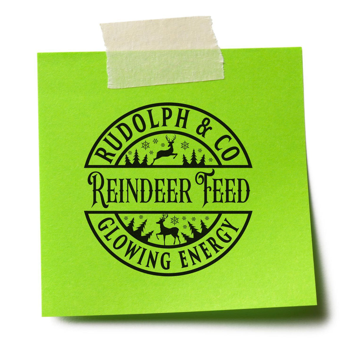 Rudolph & Co. Reindeer Feed Glowing Energy Premium Wooden Stamp - Vintage Pro imprint stamped in blue ink. A circular badge reads "Rudolph & Co. Reindeer Feed Glowing Energy" with reindeer silhouettes, trees, and stars.