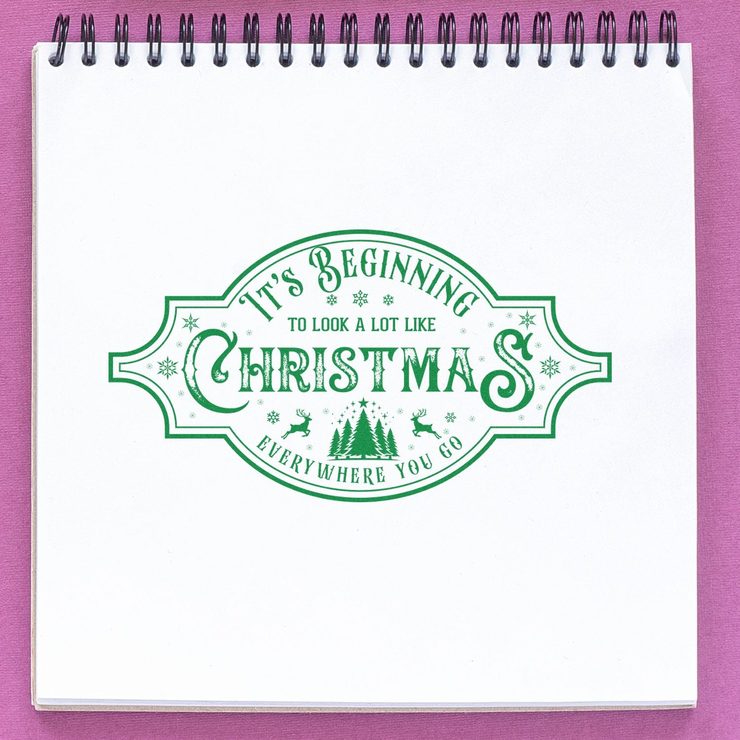 Green Christmas rubber stamp reading Its Beginning to Look a Lot Like Christmas for holiday cards, crafts, and scrapbooking.