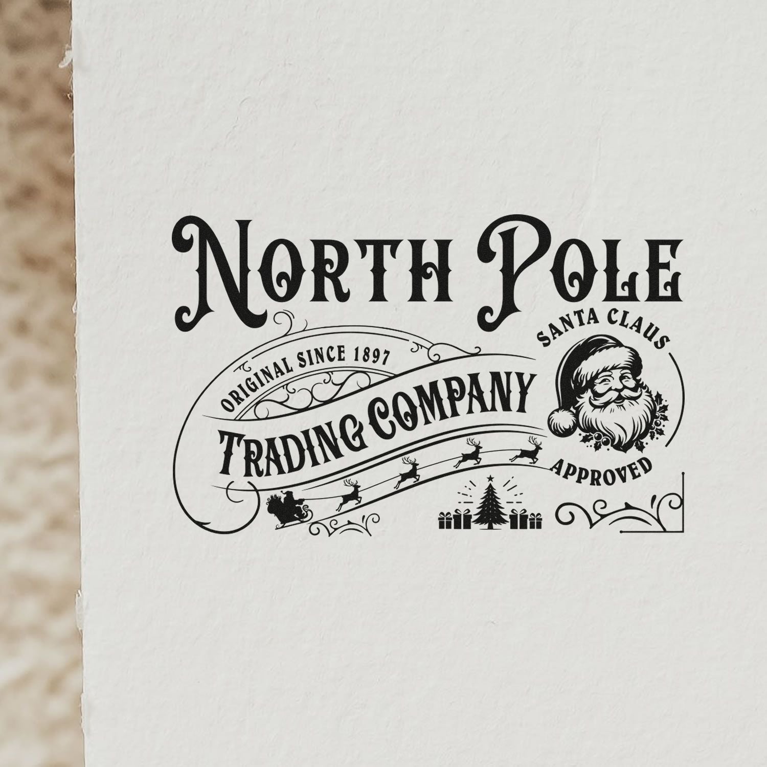 Vintage North Pole Trading Company Santa Claus Approved rubber stamp design for Christmas packaging and holiday branding.