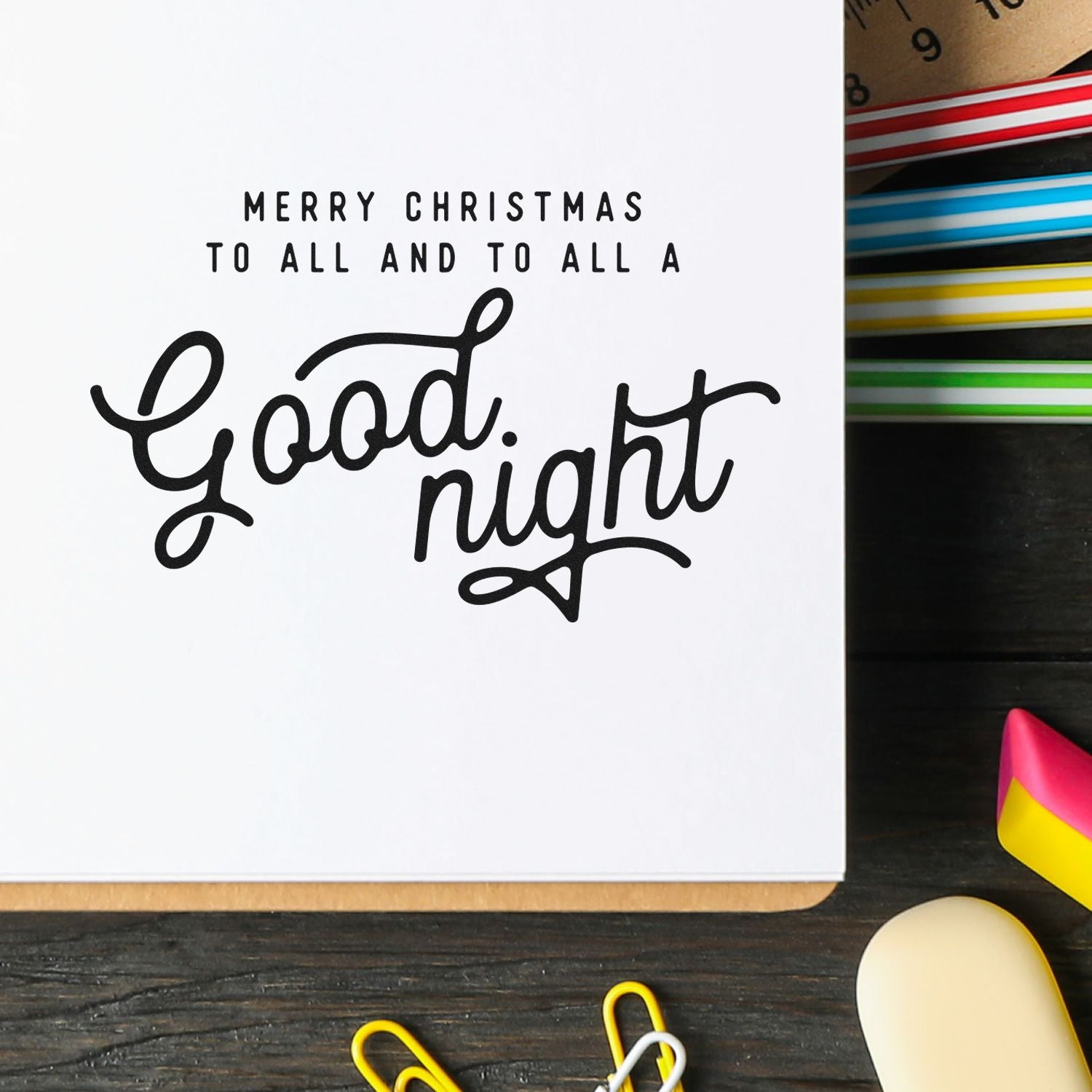 Christmas rubber stamp saying Merry Christmas to all and to all a Good night on a holiday card with colorful ink pads.