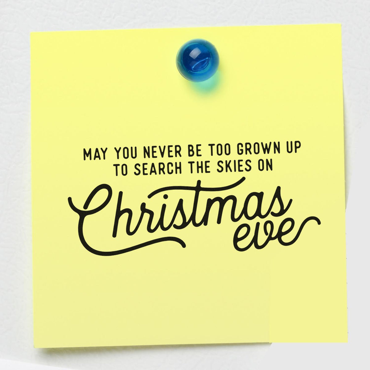 Christmas Eve rubber stamp saying May you never be too grown up to search the skies on Christmas Eve on a yellow note.