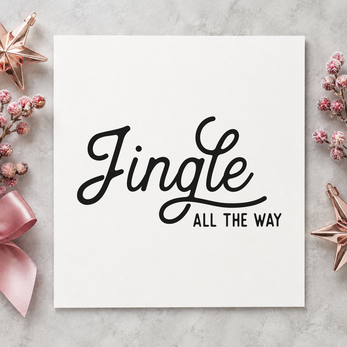 Jingle All The Way Script craft stamp imprint in black ink on a handmade project, one idea being stacked gift tags.