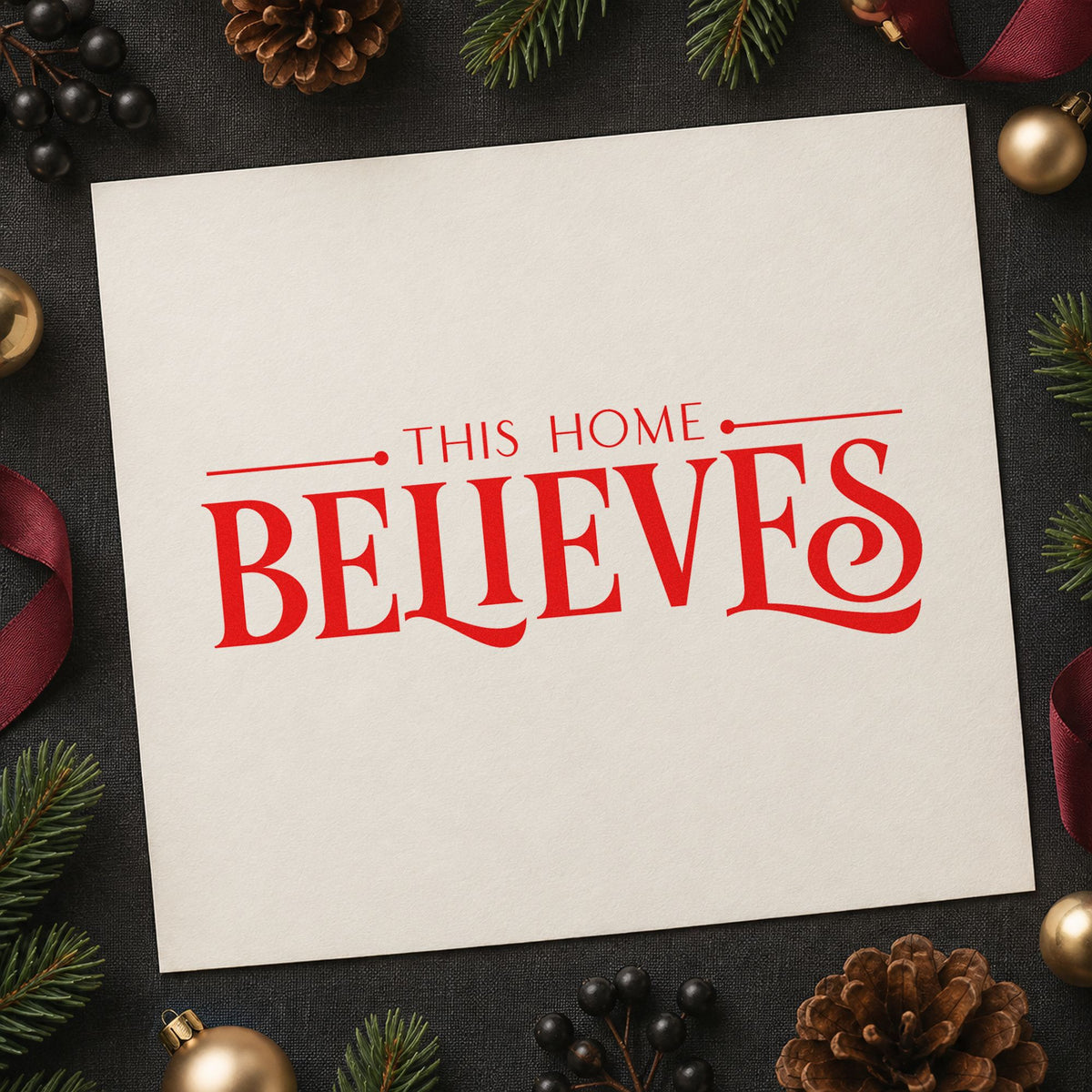 This Home Believes Serif rubber stamp shown in red ink, stamped for projects such as shelf line labels.