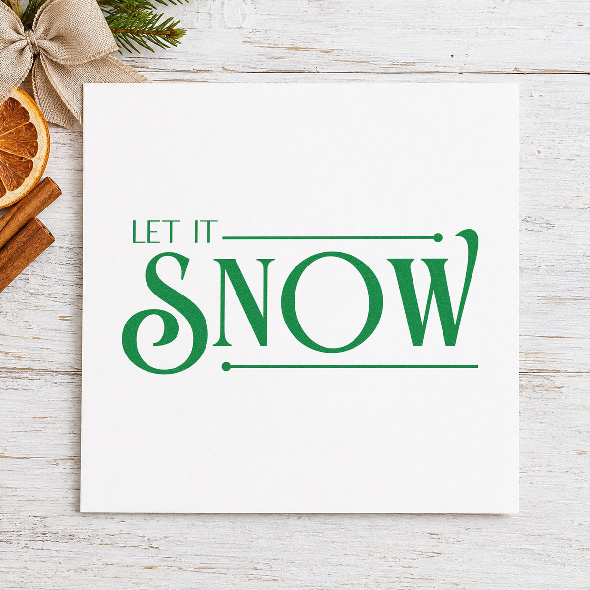 Let It Snow Serif craft stamp in green ink on cardstock, an easy option for boutique album page.