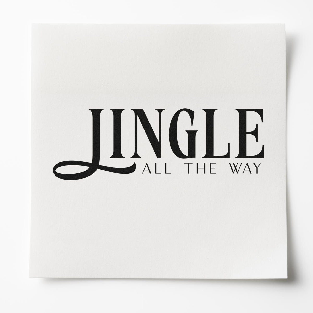 Jingle All The Way Serif Slim Pre-Inked Stamp imprint stamped in black ink. The word "Jingle" appears in large serif letters with a sweeping lower stroke and small "all the way" text.