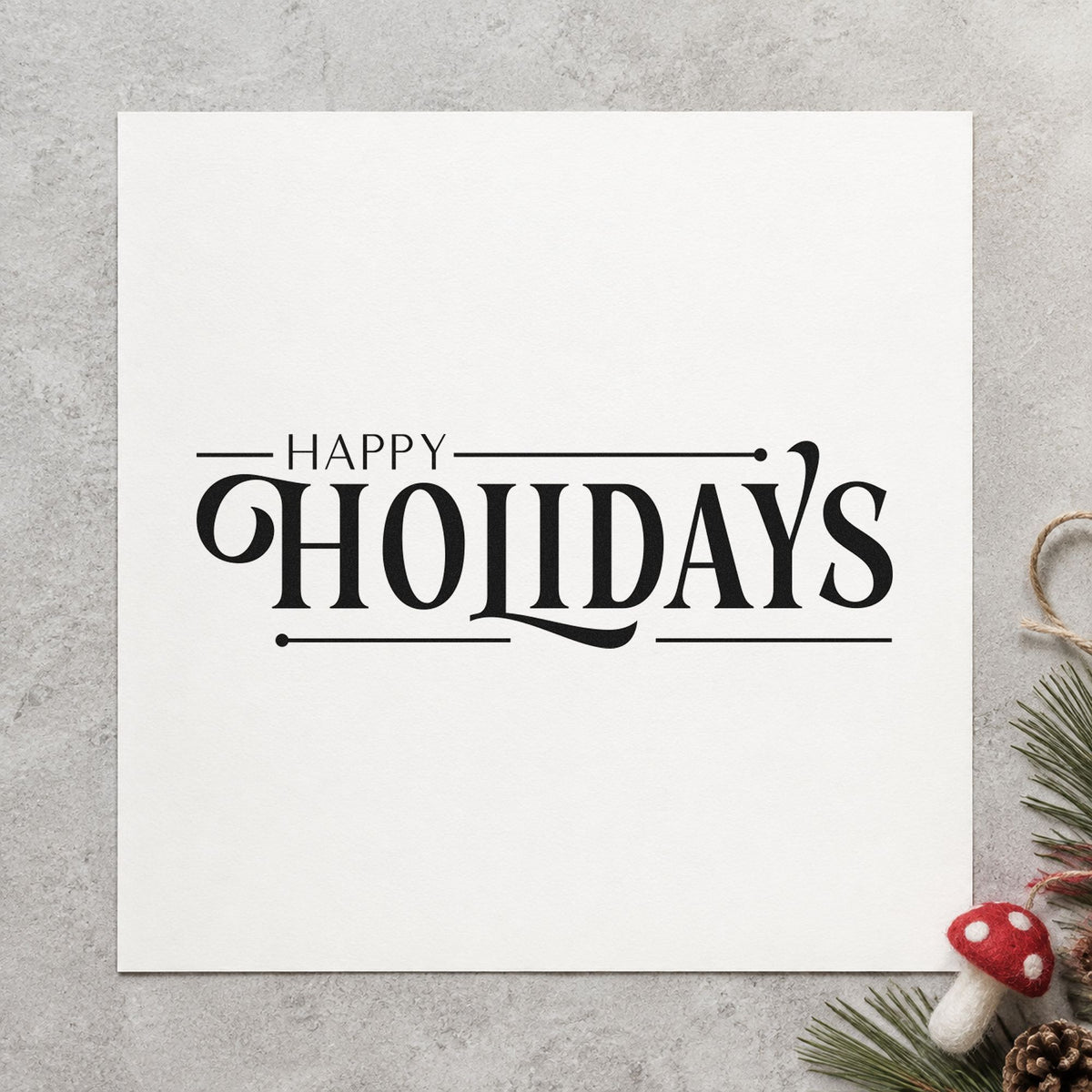 Happy Holidays Decorative Serif craft stamp imprint in black ink on a handmade project, one idea being client gift tags.