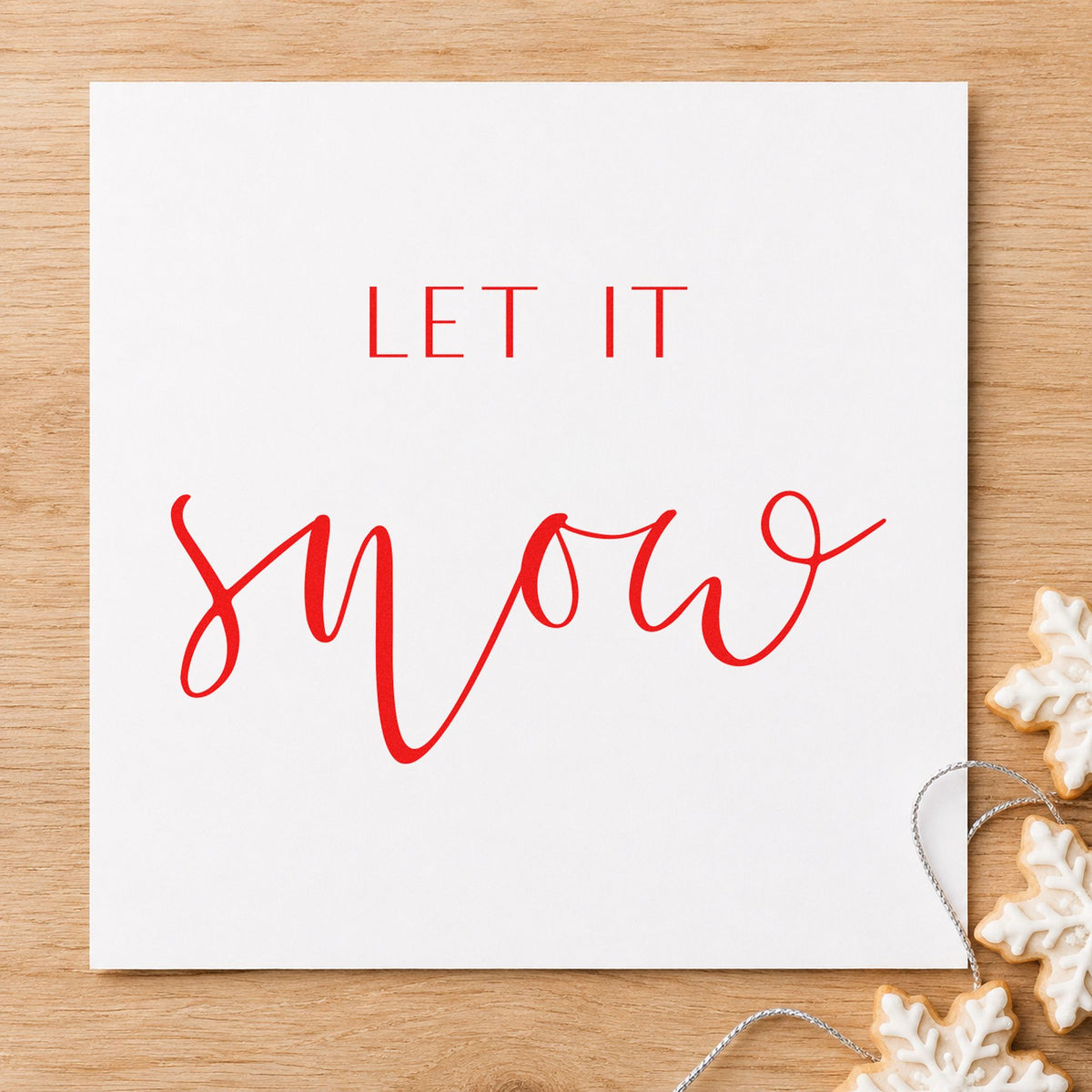 Let It Snow Fine Script craft stamp in red ink on cardstock, an easy option for robe cuff printing.