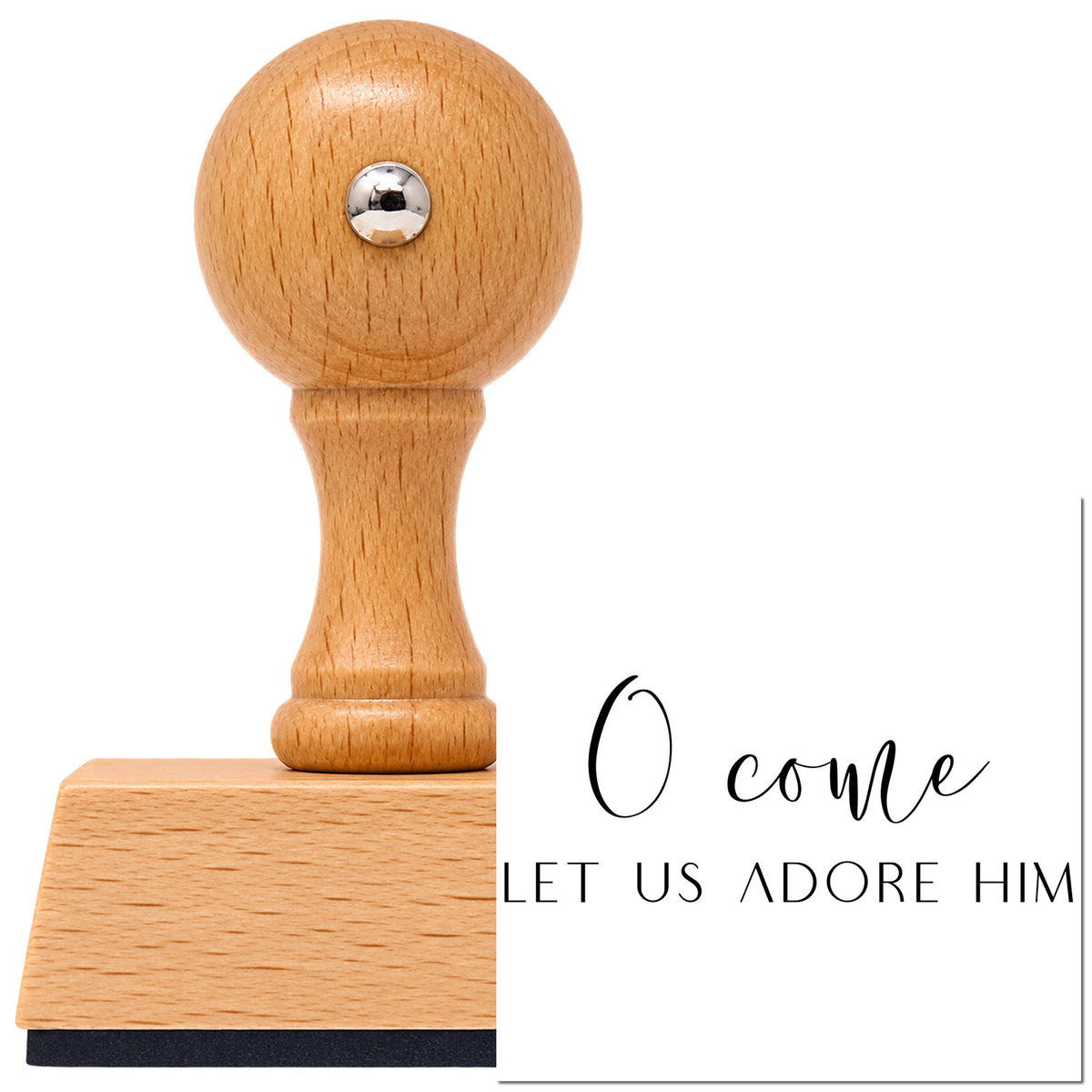 O Come Let Us Adore Him Lettering Vintage Pro rubber stamp in European beech wood with a round knob handle, shown beside its black imprint.