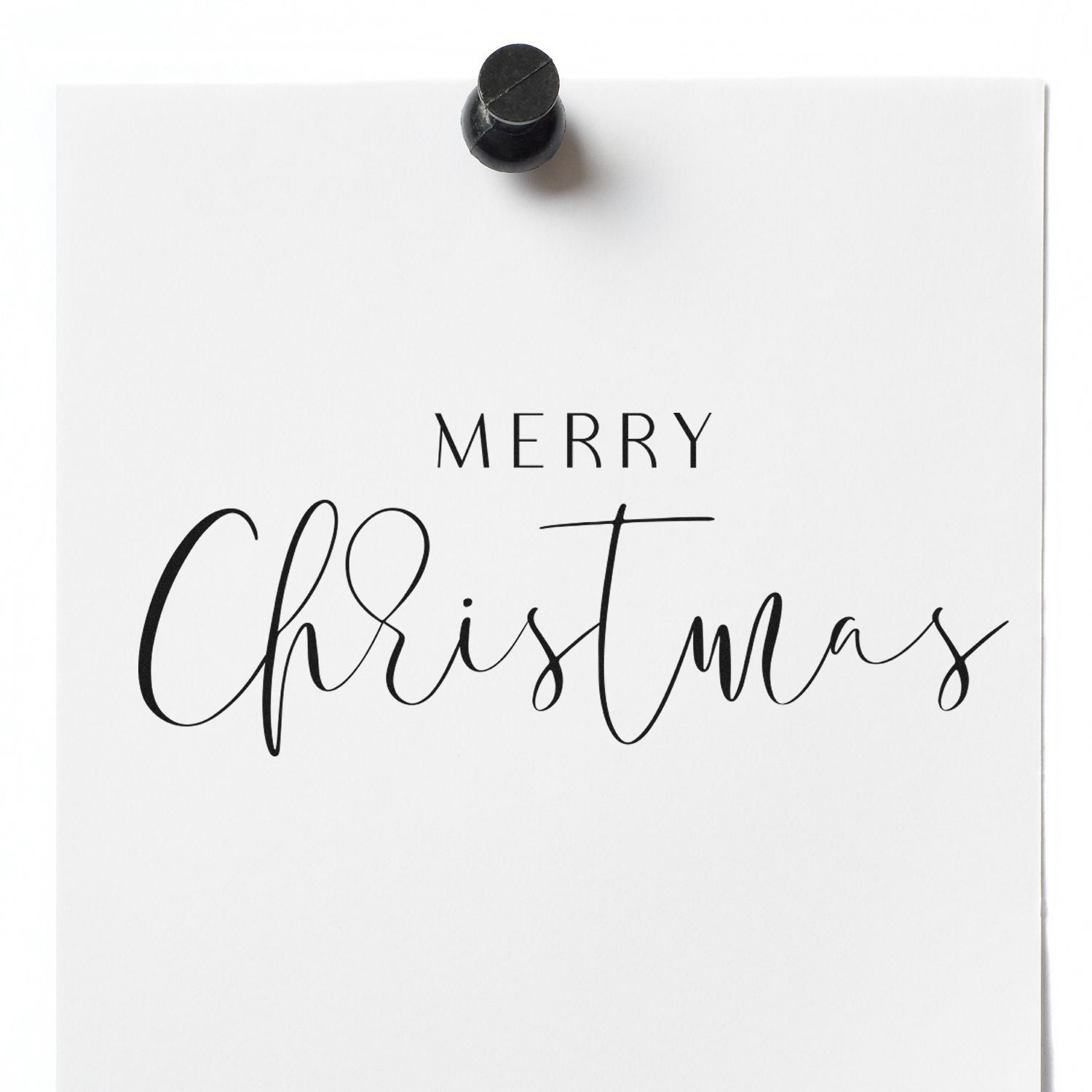 Merry Christmas rubber stamp impression on white paper, perfect for holiday cards, gift tags, and festive craft projects.
