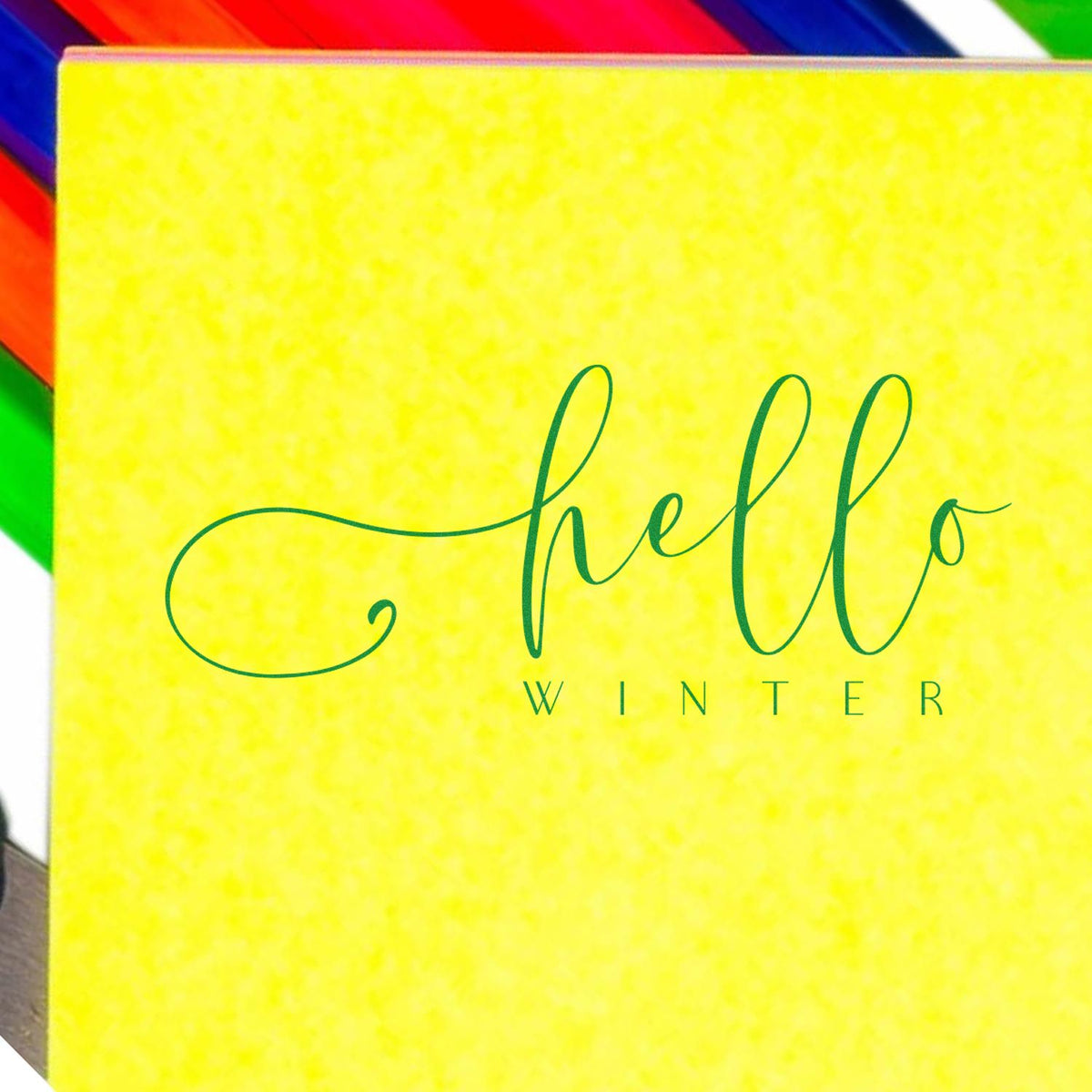 Hello Winter rubber stamp design on yellow card, ideal for seasonal greeting cards, crafts, and scrapbook projects.