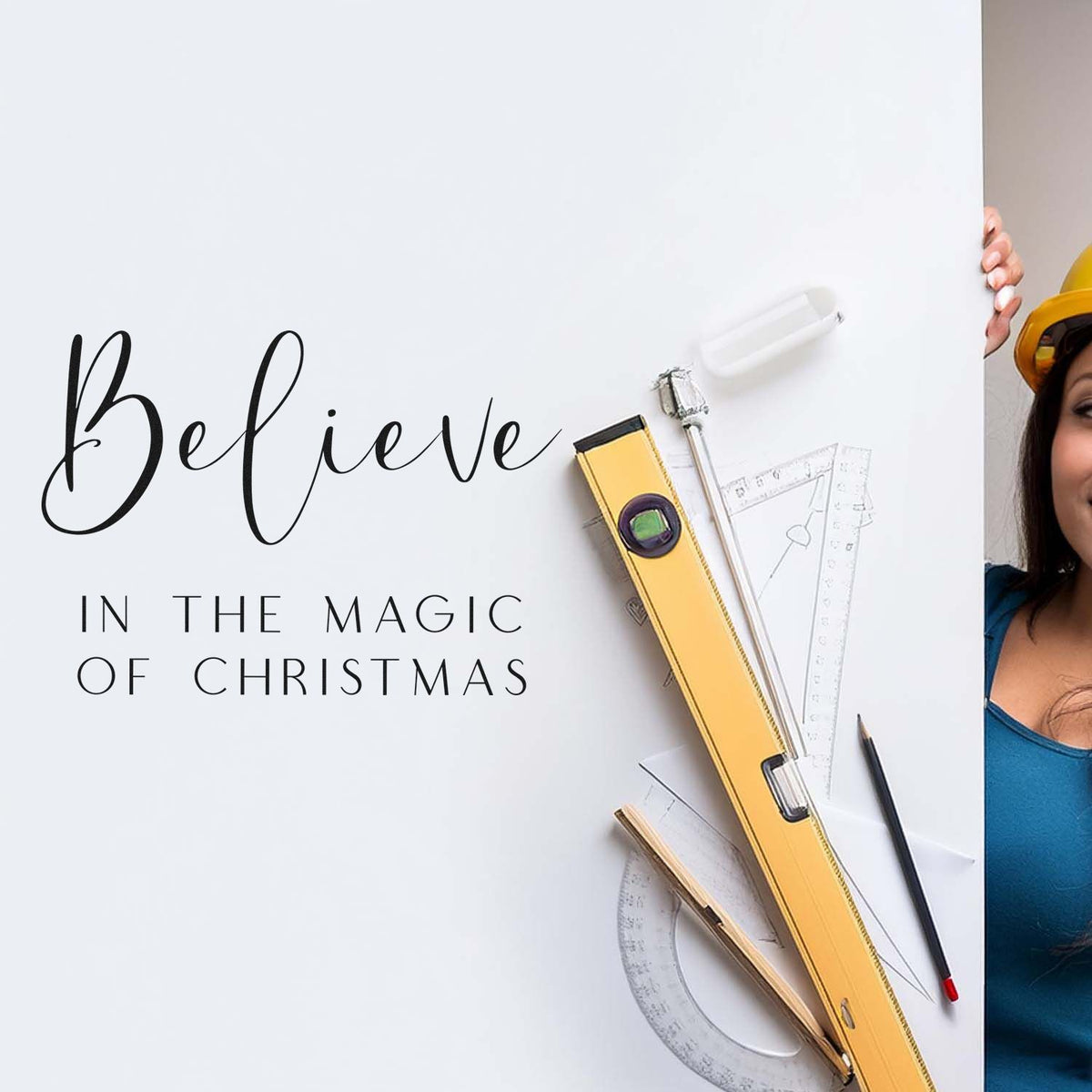 Christmas rubber stamp design with Believe in the Magic of Christmas lettering and drafting tools on a white background.