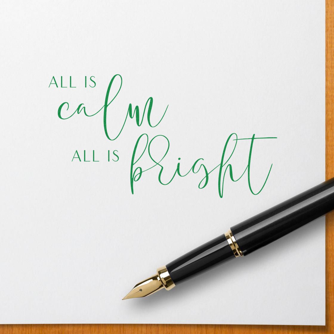 Christmas rubber stamp design with All is calm, all is bright in elegant green script for holiday cards and stationery.