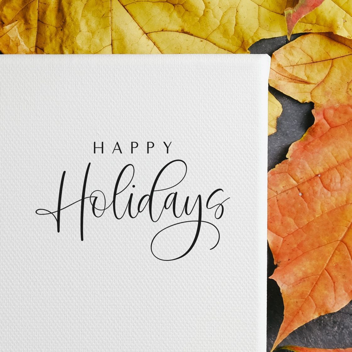 Happy Holidays rubber stamp design on white textured card with autumn leaves, ideal for festive handmade greeting cards.