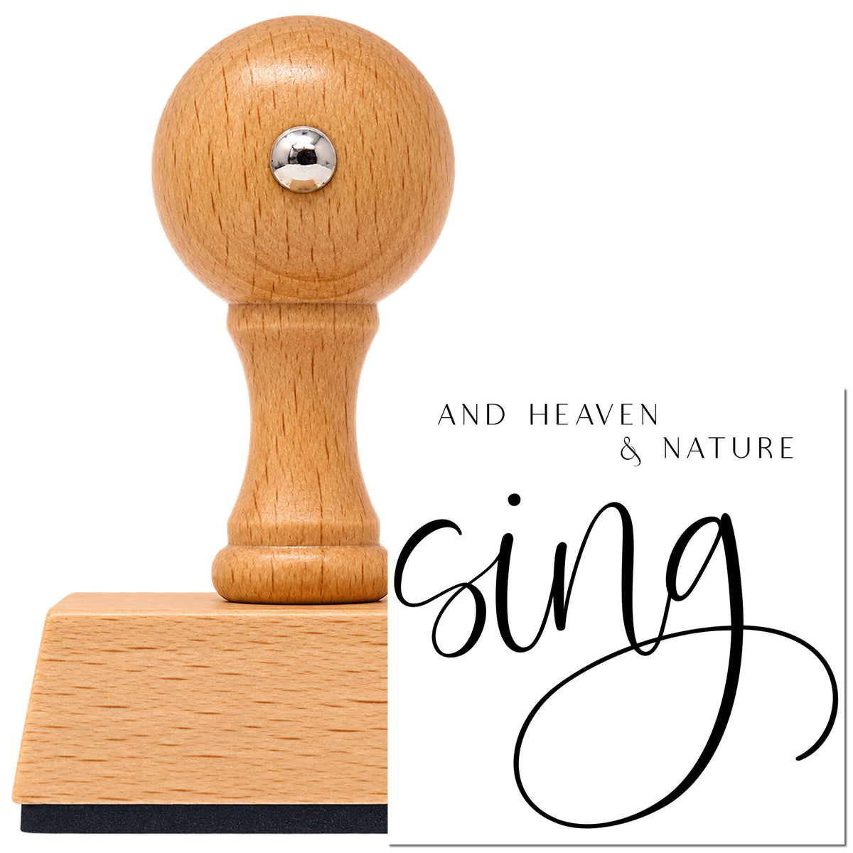 Heaven And Nature Sing Lettering Vintage Pro rubber stamp in European beech wood with a round knob handle, shown beside its black imprint.