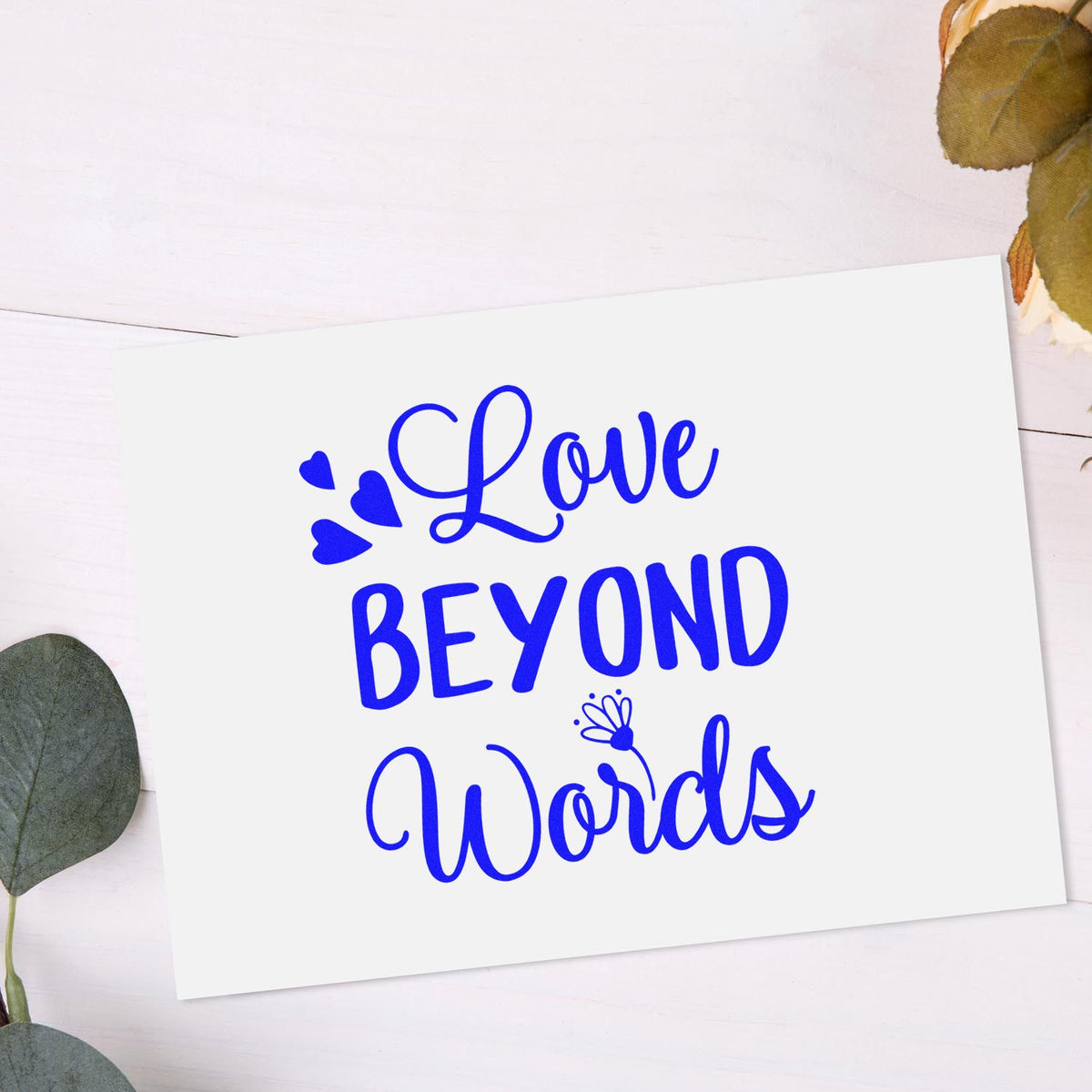 Love Beyond Words rubber stamp design in blue script with hearts, perfect for greeting cards, crafts, and heartfelt messages.