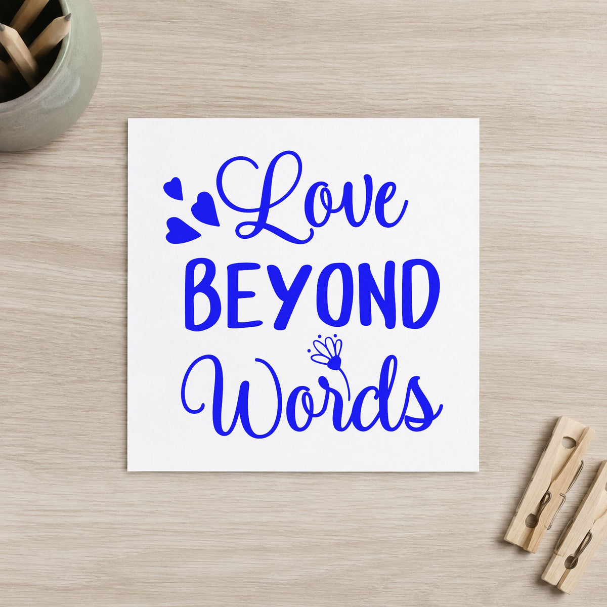 Love Beyond Words Hearts craft stamp in blue ink on cardstock, an easy option for pillow corner printing.
