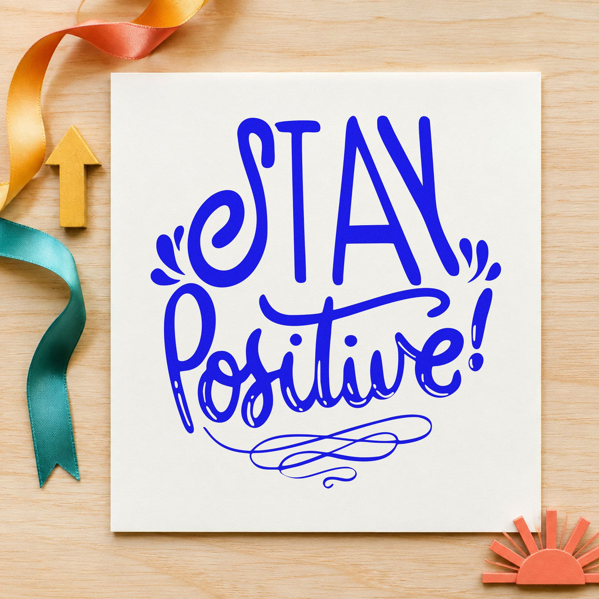 Stay Positive Decorative Script craft stamp in blue ink on cardstock, an easy option for warmup shirt printing.