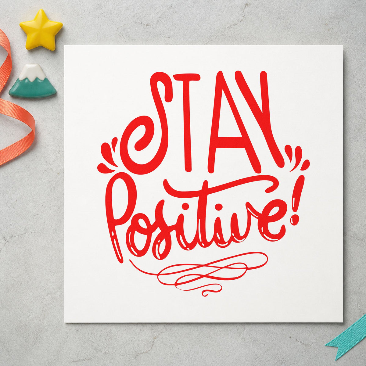 Stay Positive Decorative Script craft stamp imprint in red ink on a handmade project, one idea being roster slip cards.