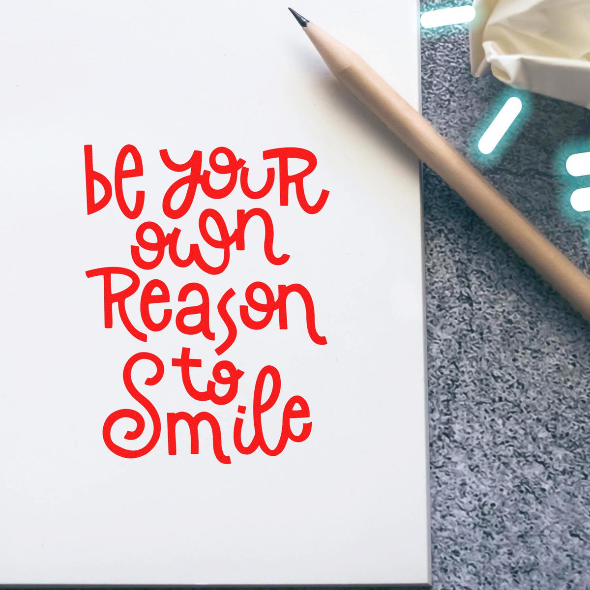 Inspirational rubber stamp design reading Be Your Own Reason to Smile for crafts, journaling, and DIY stationery.