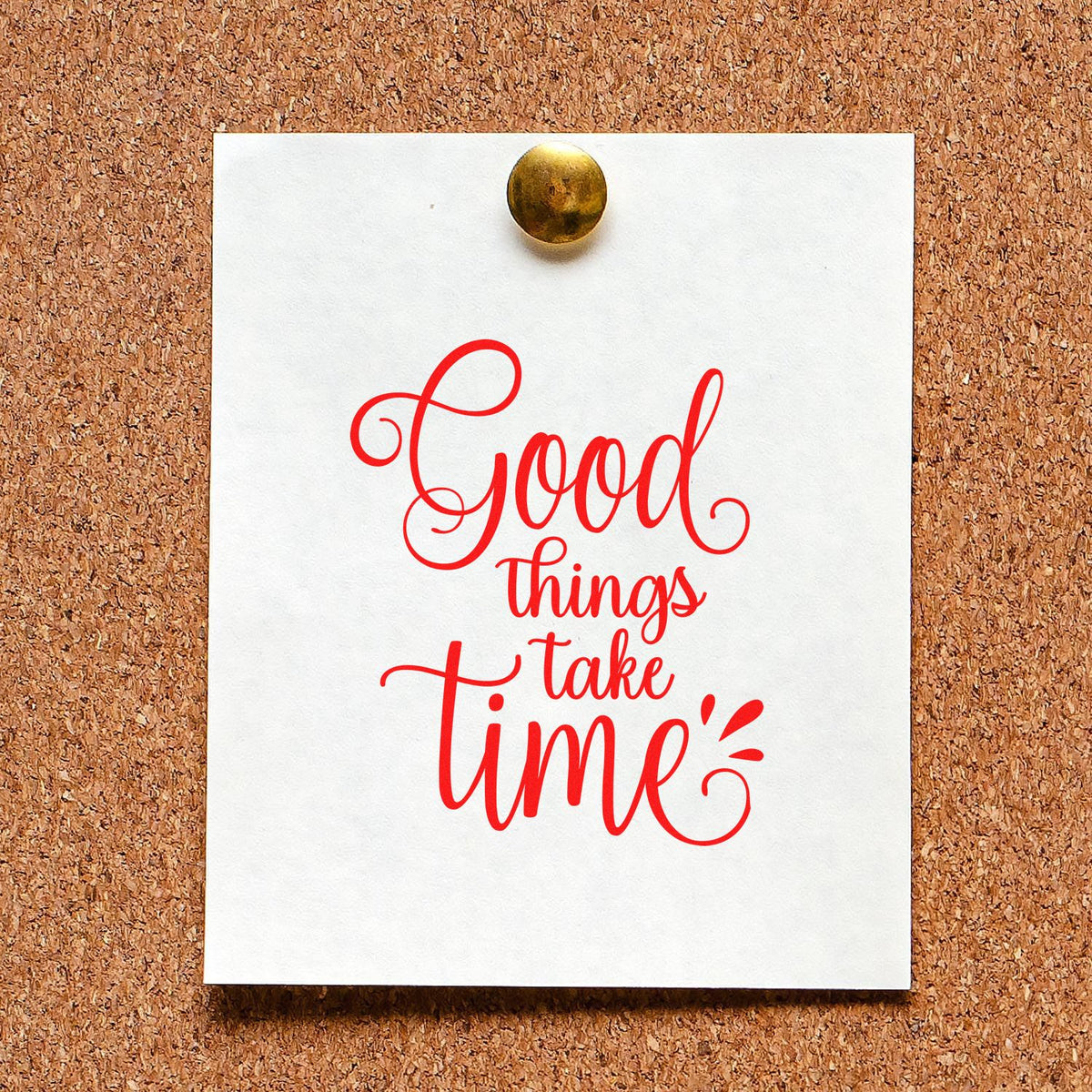 Motivational rubber stamp sample with red Good things take time design on a pinned white card.