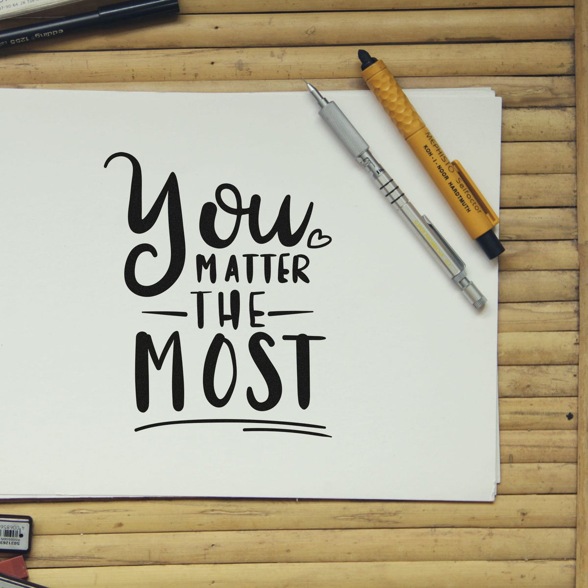 Custom rubber stamp design with You Matter the Most calligraphy, ideal for handmade cards, stationery, and heartfelt crafts.
