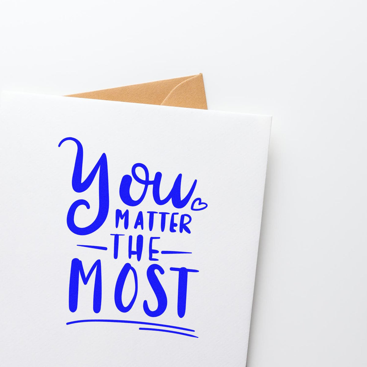 Custom rubber stamp design for greeting cards reading You matter the most in blue hand-lettering.