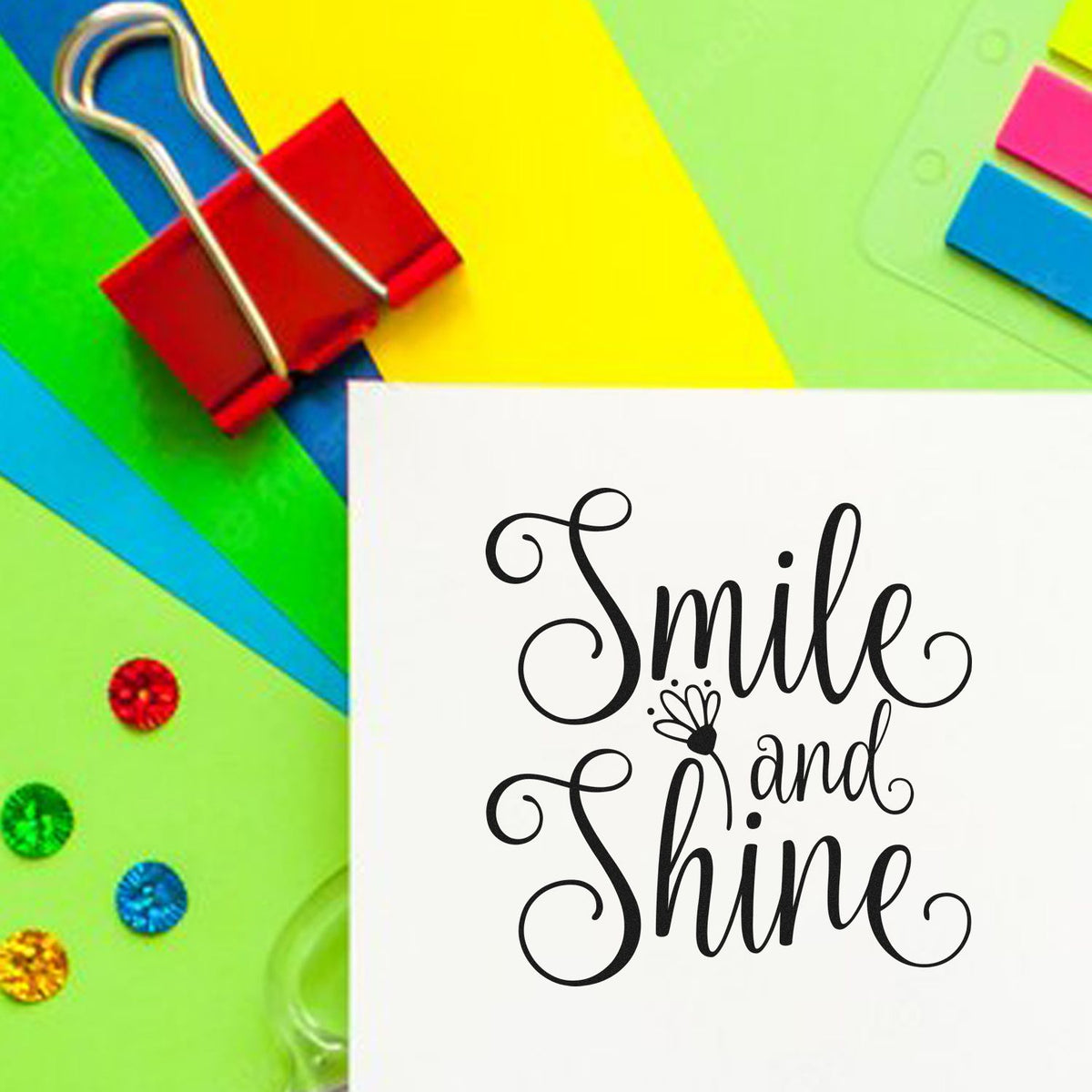 Decorative rubber stamp with Smile and Shine script on paper craft background, ideal for handmade cards and scrapbooking.