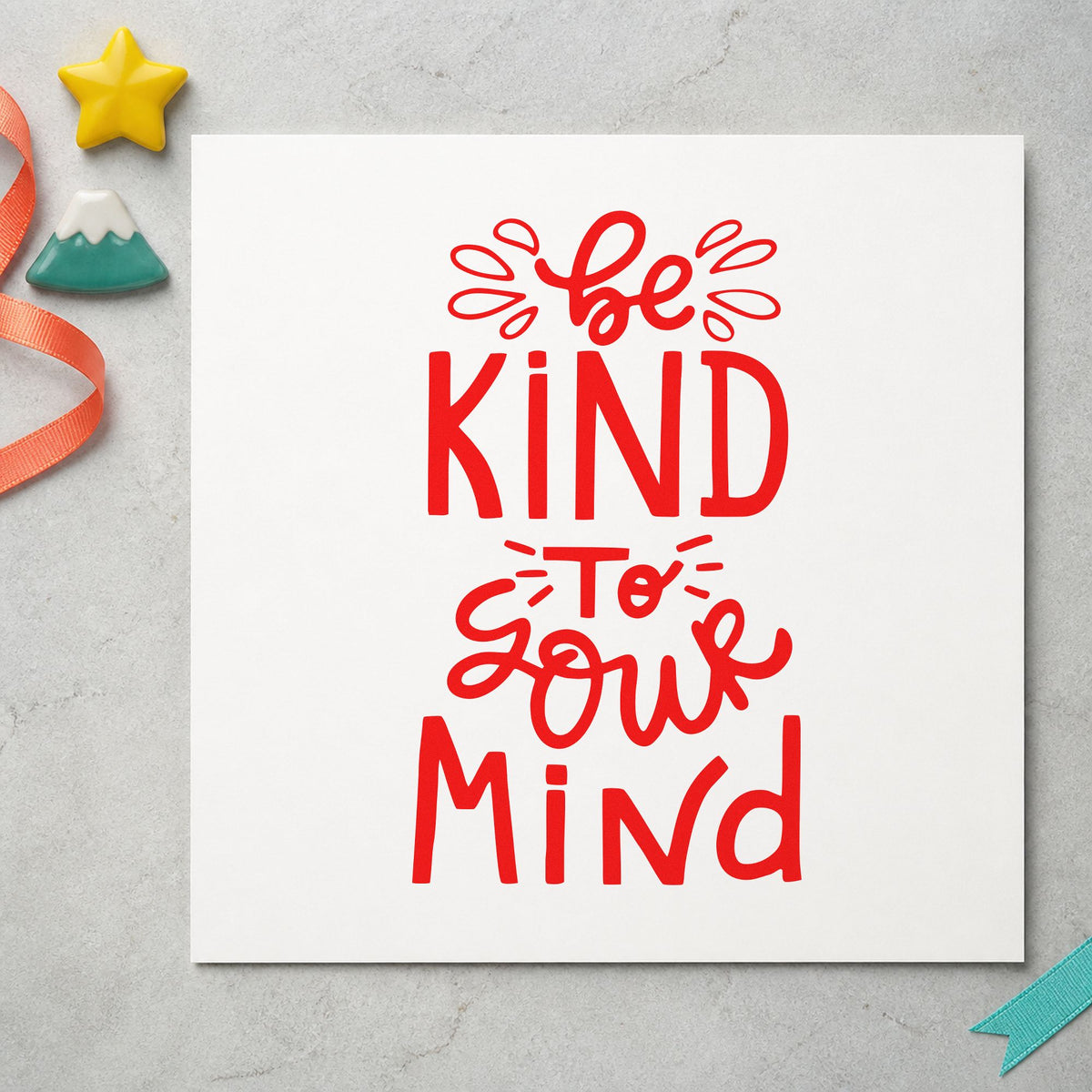 Be Kind To Your Mind craft stamp imprint in red ink on a handmade project, one idea being breath prompt cards.