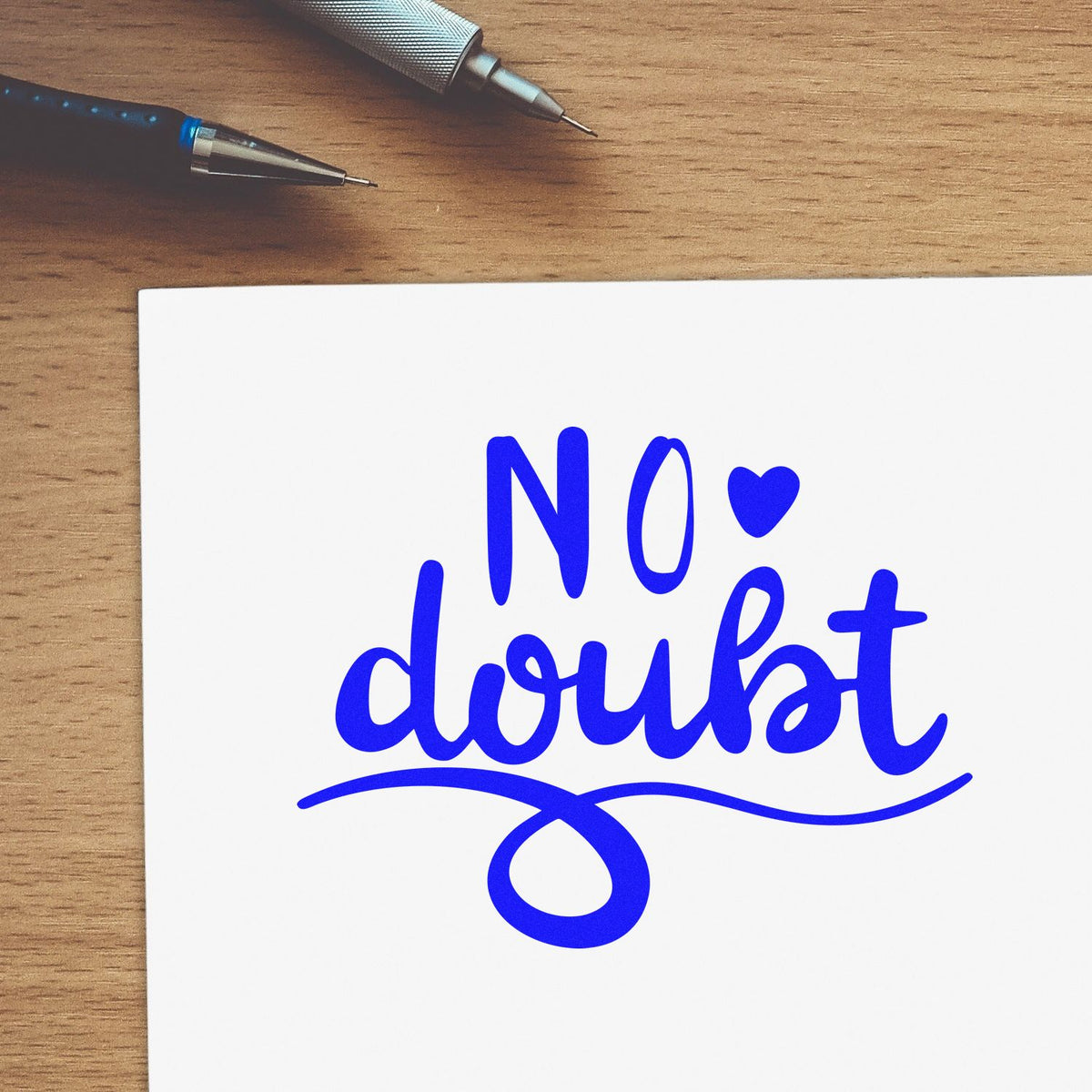 Blue No doubt rubber stamp design on paper, ideal for custom crafts, stationery, and office labeling.