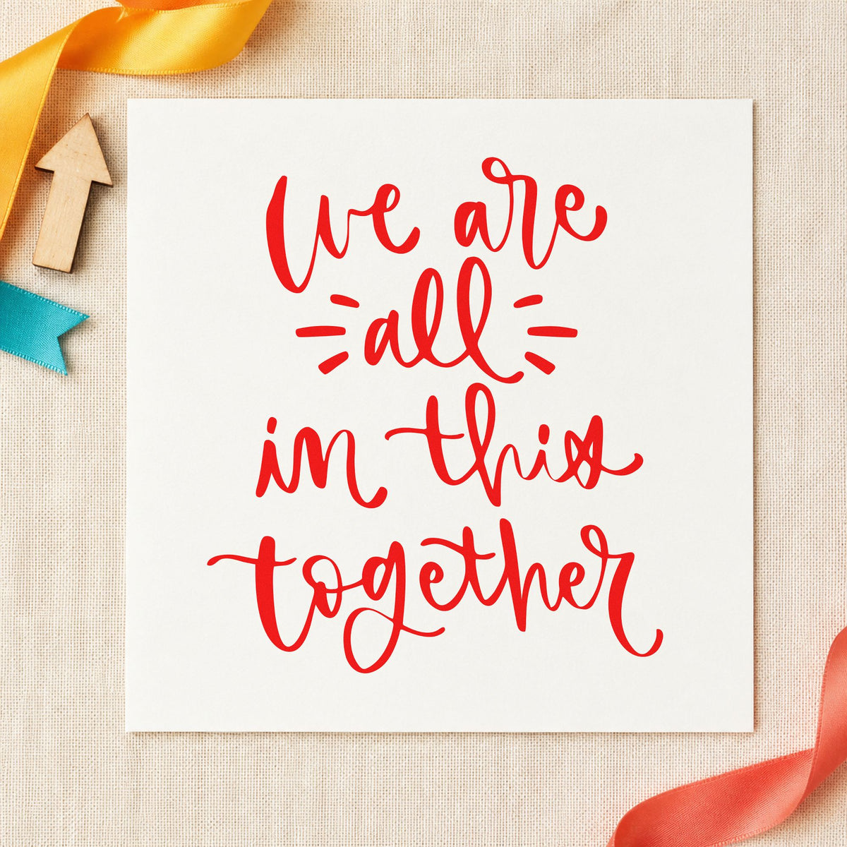 We Are All In Together rubber stamp shown in red ink, stamped for projects such as bin supply labels.