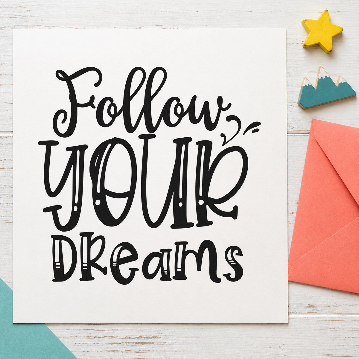 Follow Your Dreams Lettering craft stamp imprint in black ink on a handmade project, one idea being merch bundle gift tags.