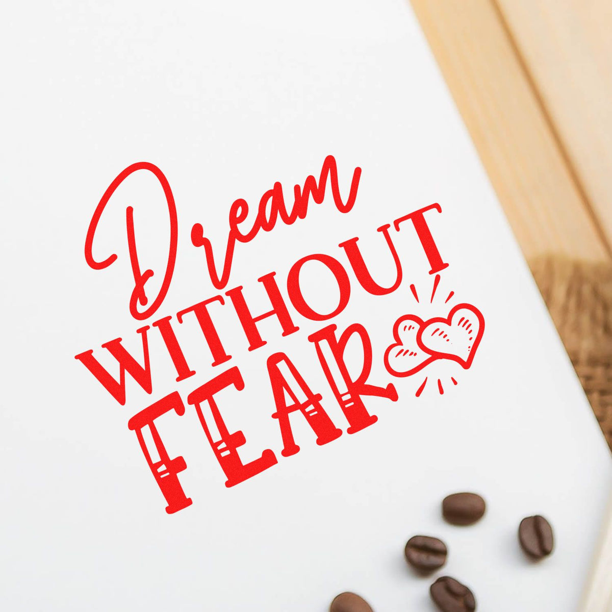 Red Dream Without Fear custom rubber stamp design on white paper with hearts and coffee beans for inspirational crafts.
