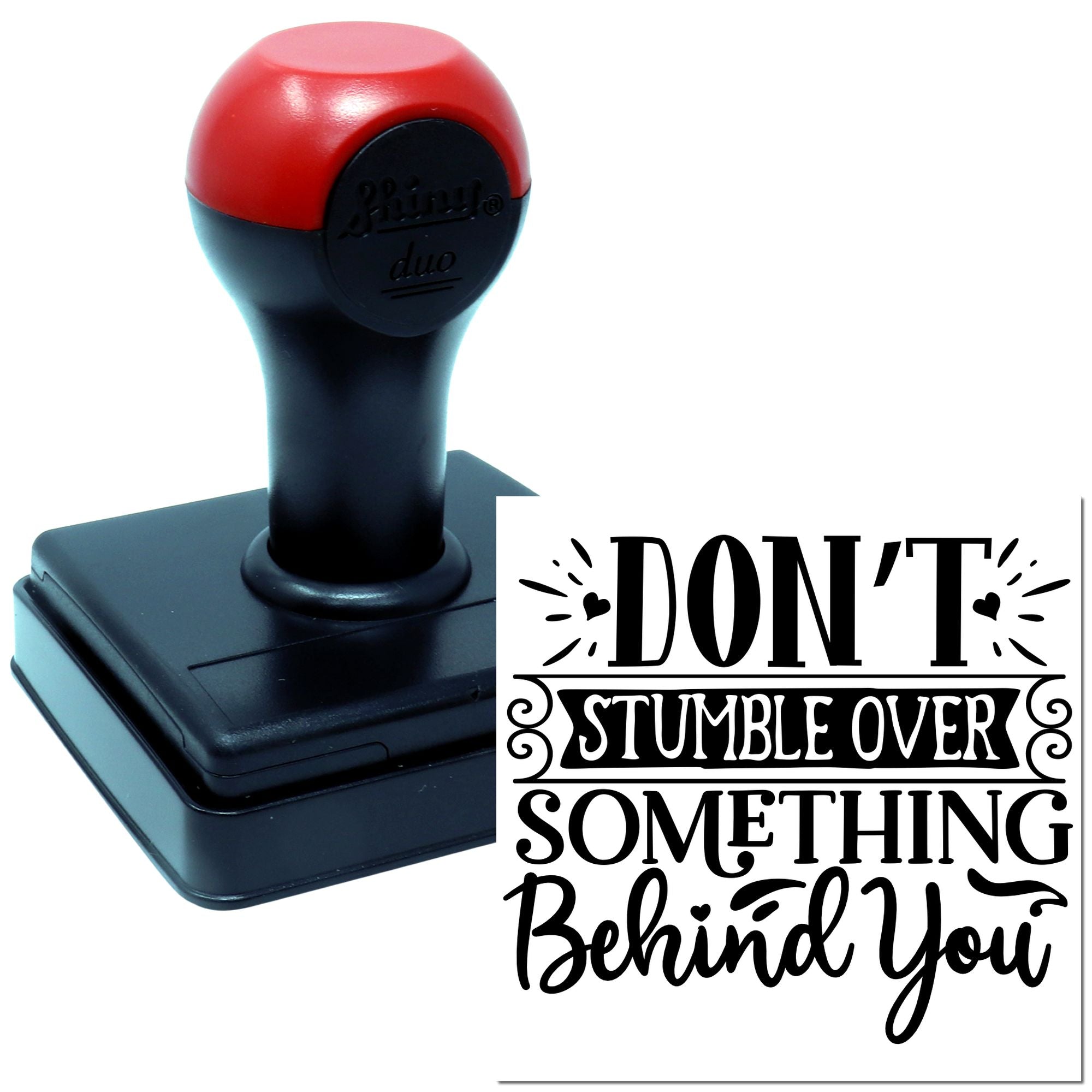 Self-inking rubber stamp featuring the quote Dont stumble over something behind you for inspirational crafting.