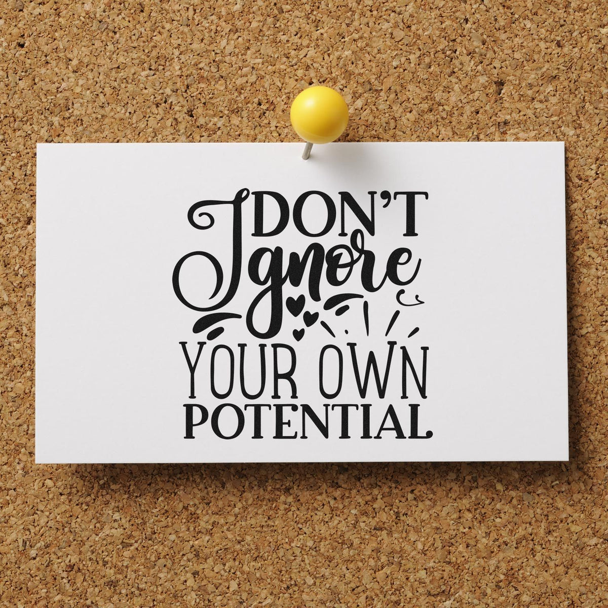 Custom rubber stamp design with motivational quote, Dont ignore your own potential, on a pinned white card.