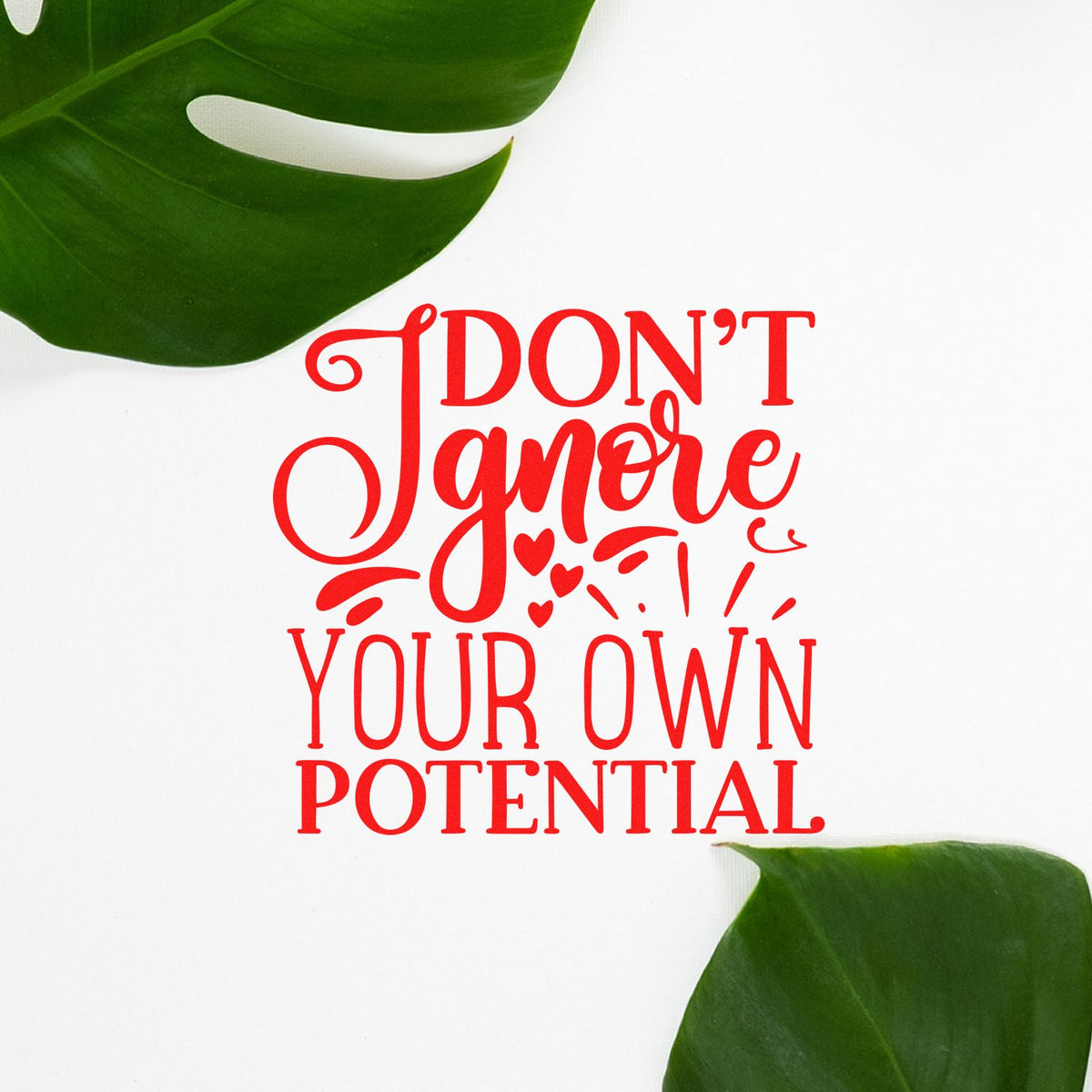 Motivational rubber stamp design with red Dont ignore your own potential text and green tropical leaves on white background.
