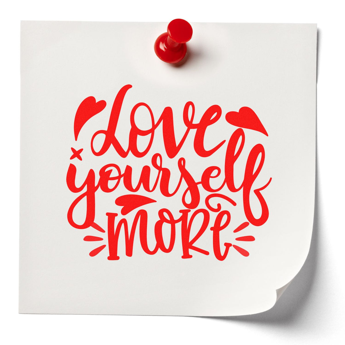 Love Yourself More red motivational rubber stamp design on pinned white note with heart accents