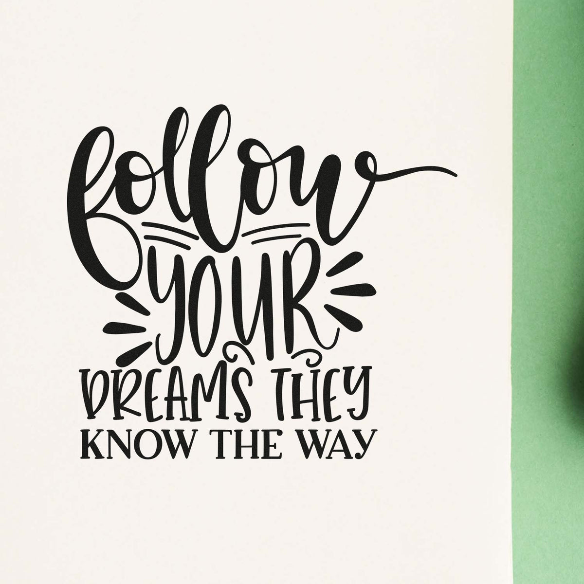 Inspirational custom rubber stamp design with quote, Follow your dreams they know the way, in black lettering on white.