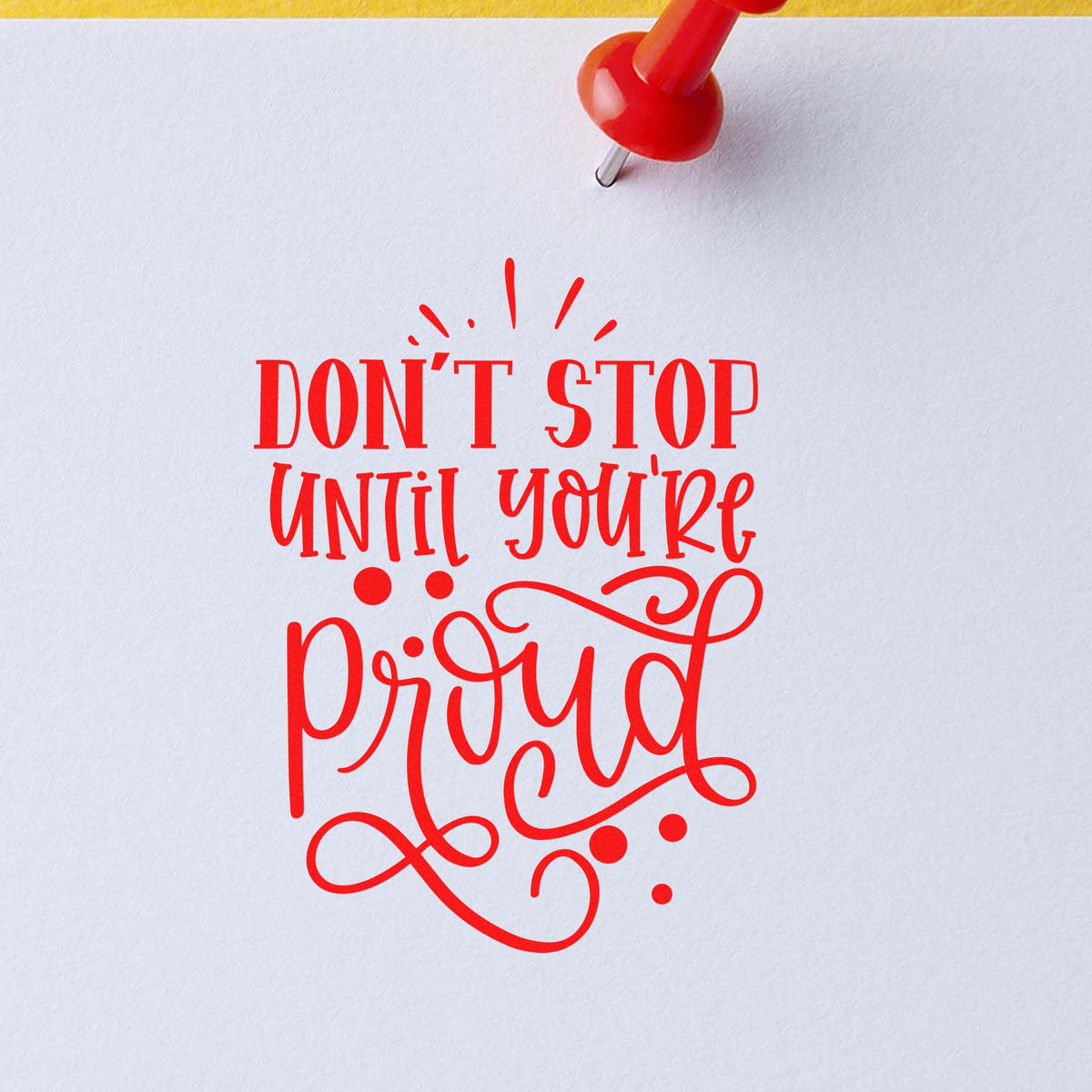 Motivational rubber stamp design reading Dont Stop Until Youre Proud in bold red lettering.