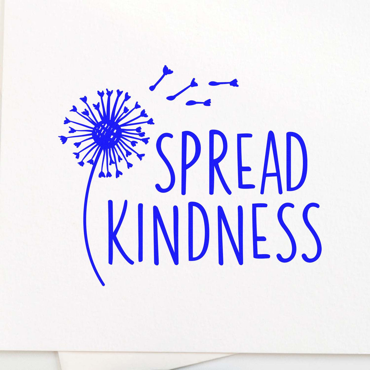 Spread Kindness rubber stamp design with dandelion seed graphic in blue ink for inspirational craft projects