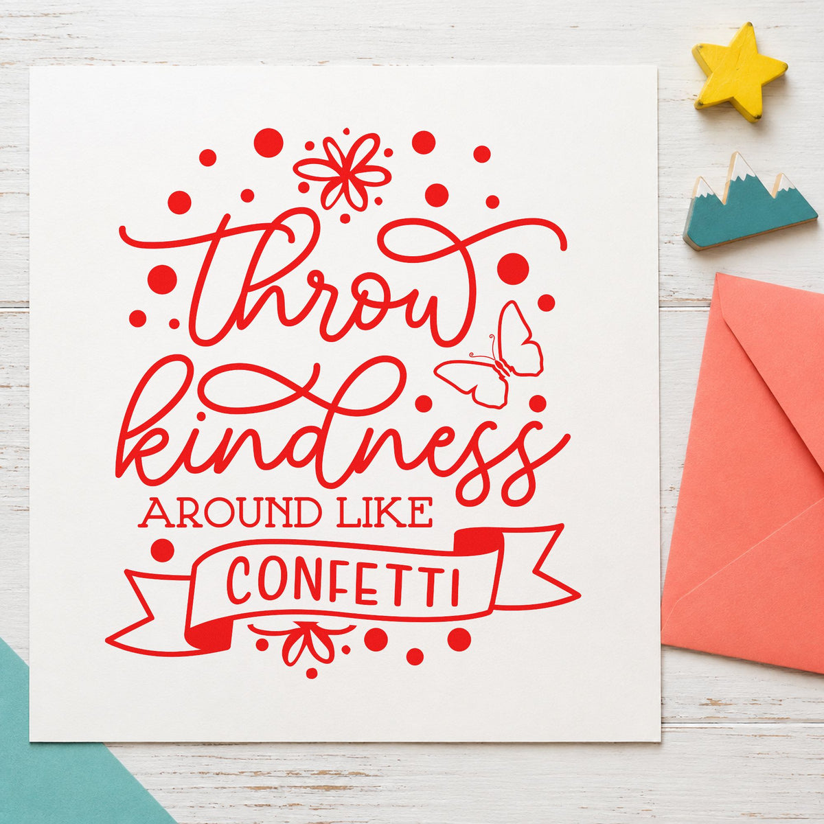 Throw Kindness Like Confetti rubber stamp shown in red ink, stamped for projects such as bin color labels.