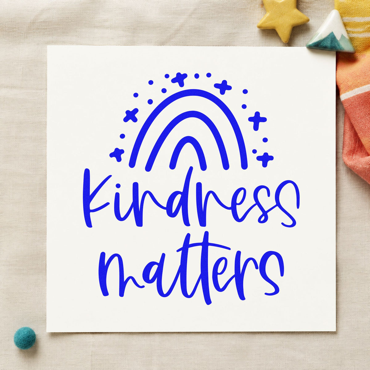 Kindness Matters Starry Rainbow craft stamp in blue ink on cardstock, an easy option for sideline banner printing.