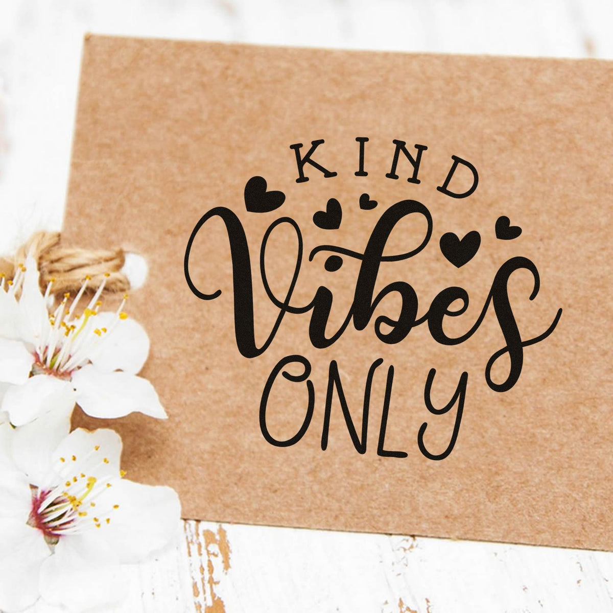 Kind Vibes Only rubber stamp design with hearts on kraft paper for handmade cards and packaging.