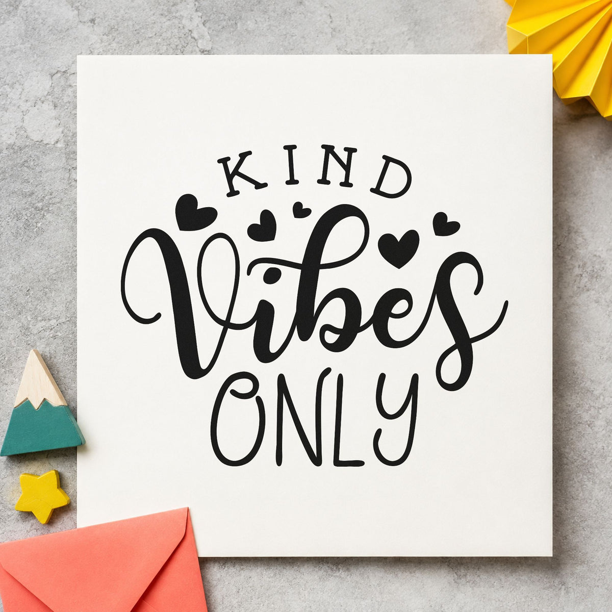 Kind Vibes Only Hearts craft stamp imprint in black ink on a handmade project, one idea being deck gift tags.